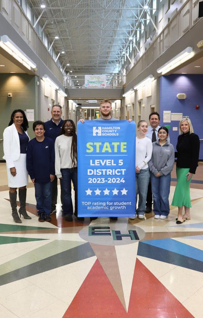 Students pose for a banner presentation photo at EHHS