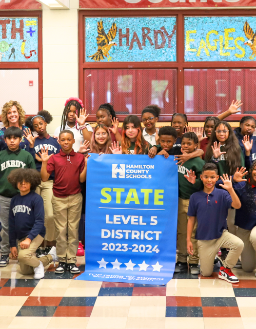 Students pose for a banner presentation photo