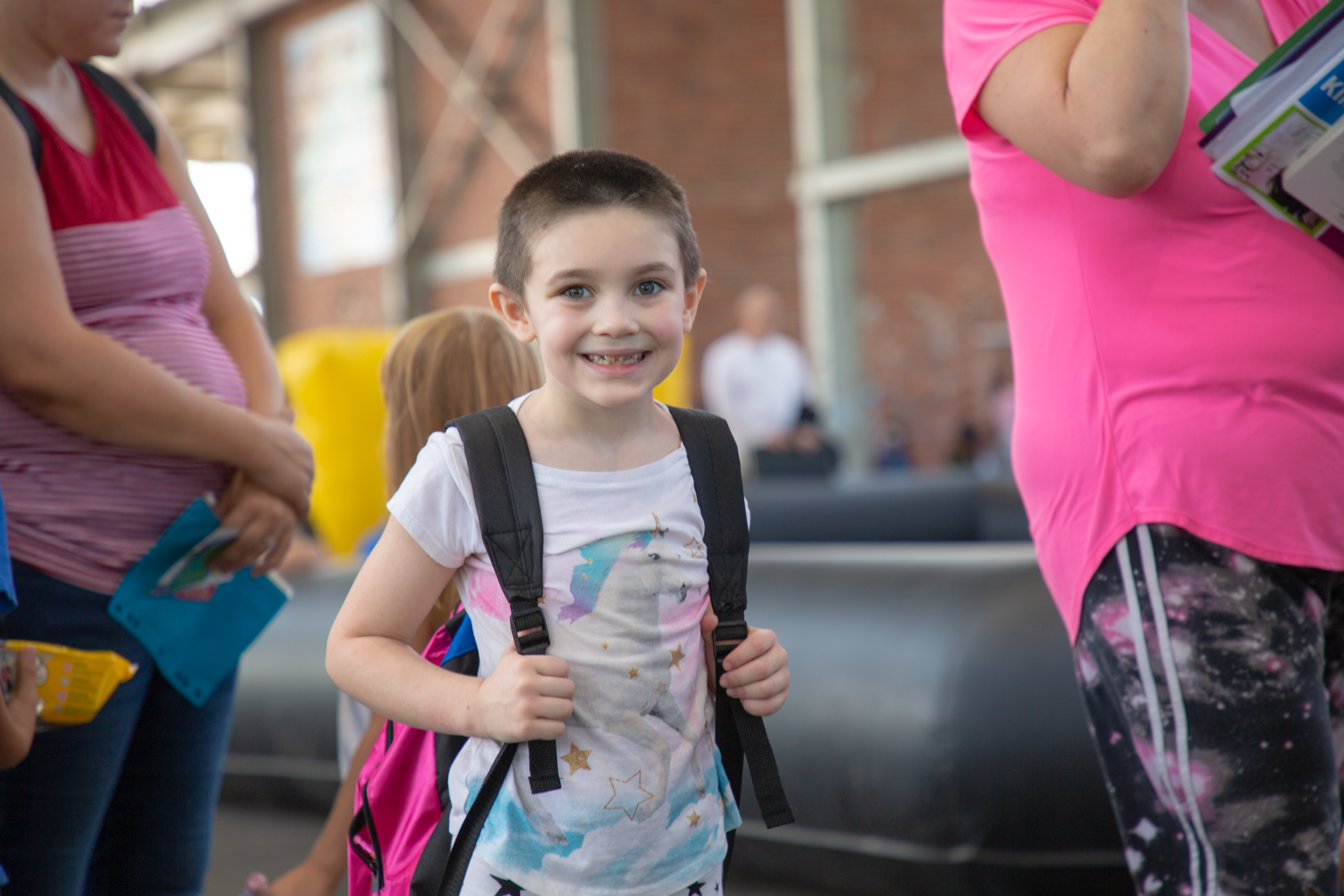 A child smiles for a photo