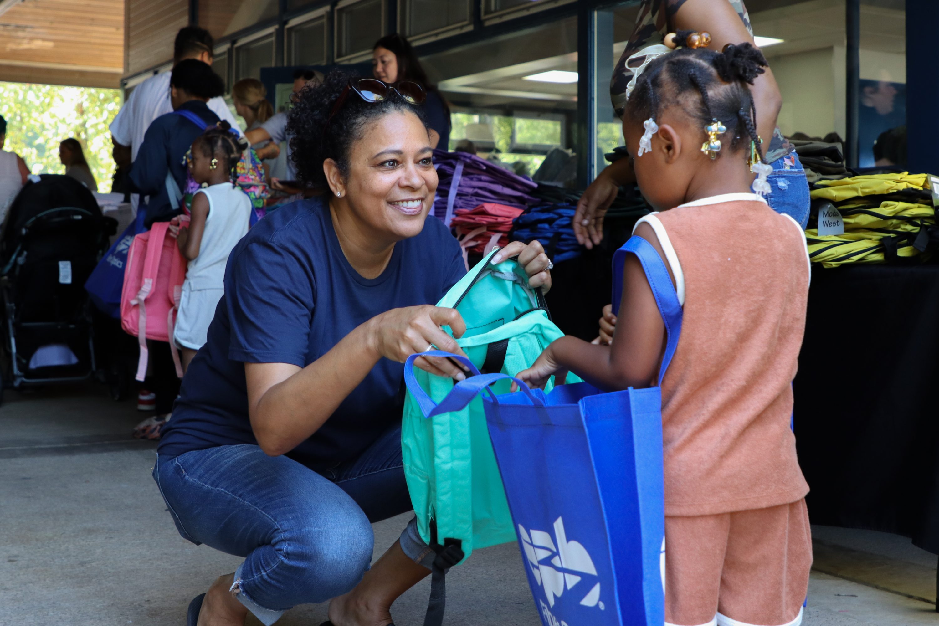 Dr. Stewart talks to a young student