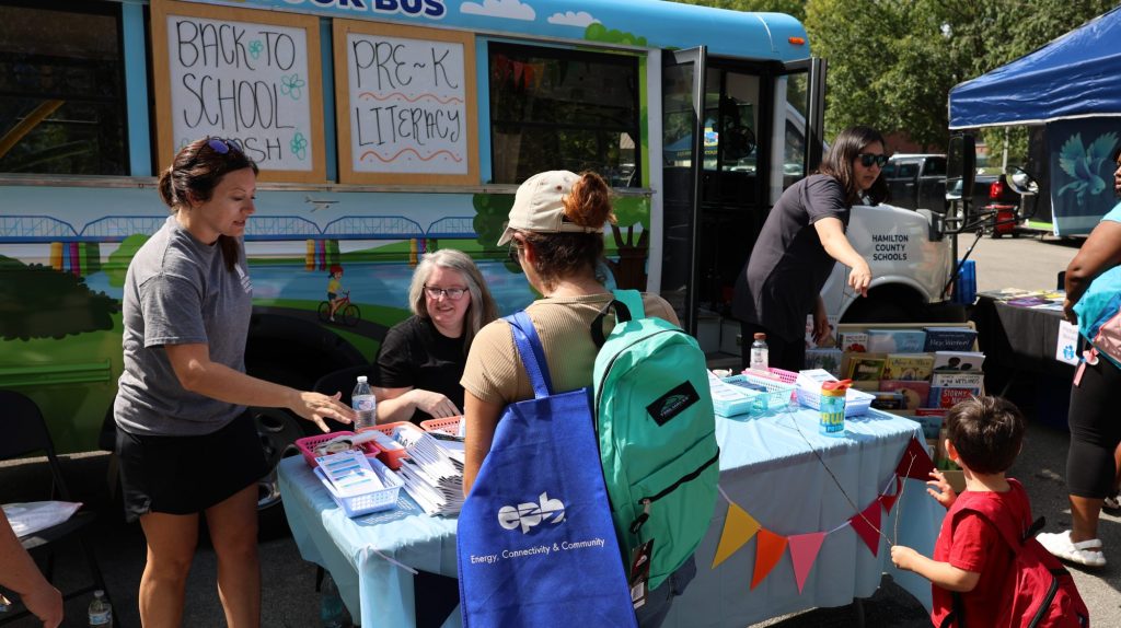 People check out the book bus