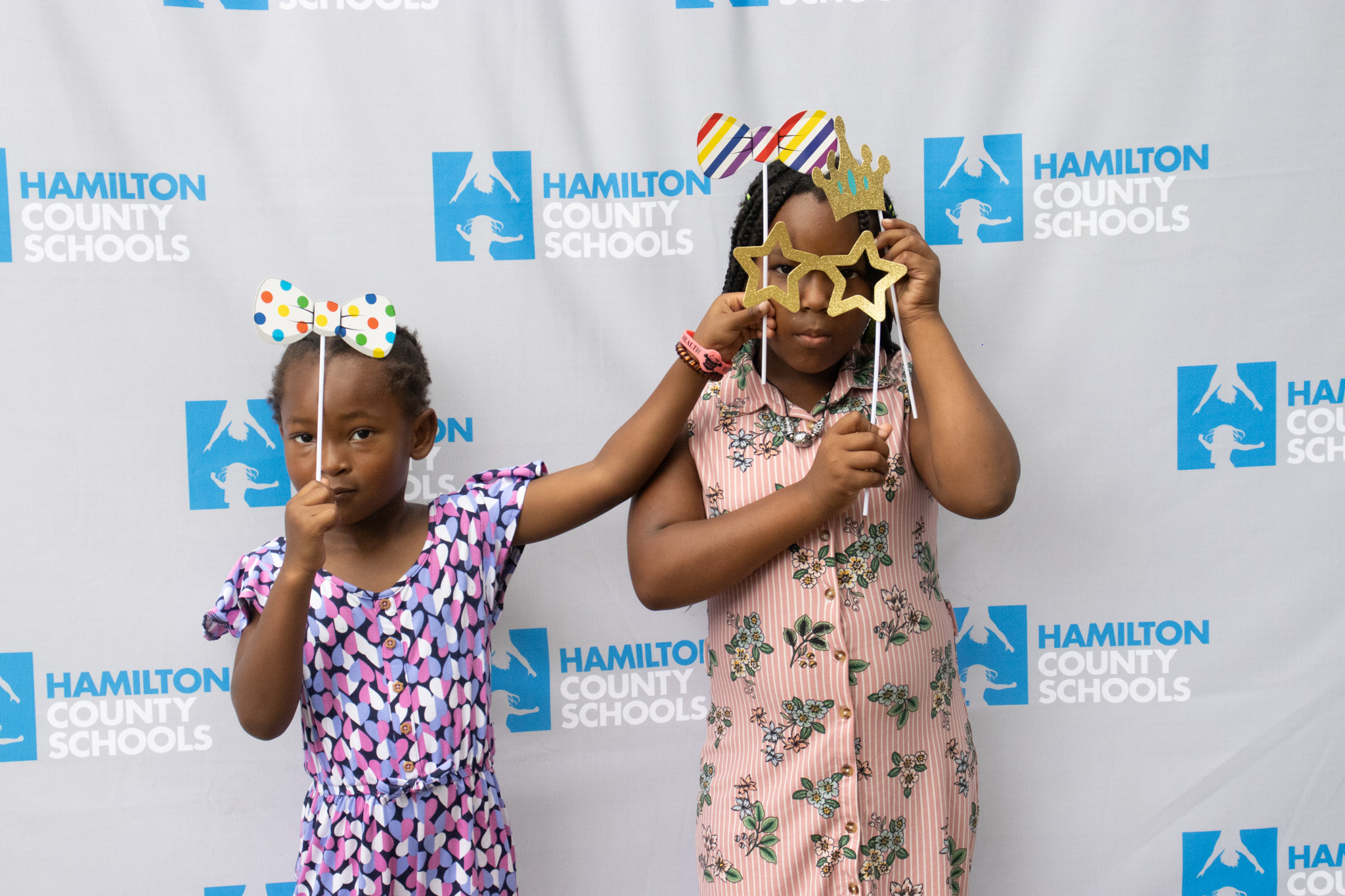 Two children pose with props