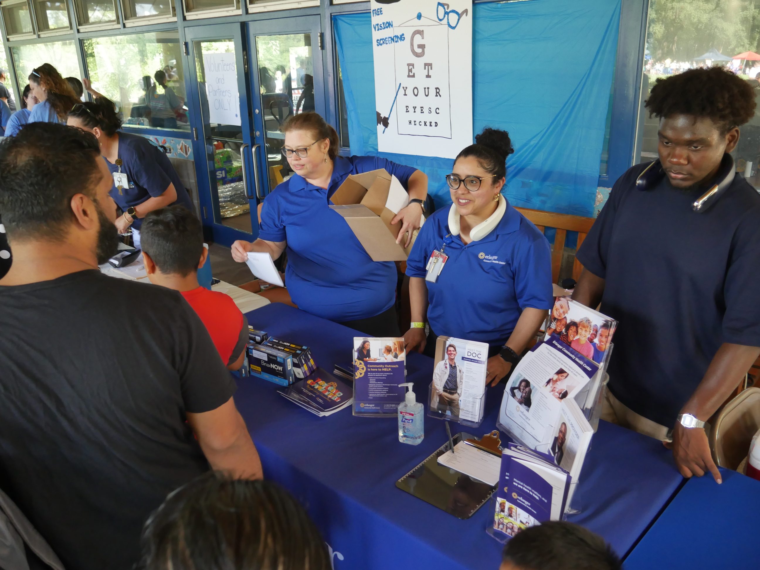 Booth workers help families