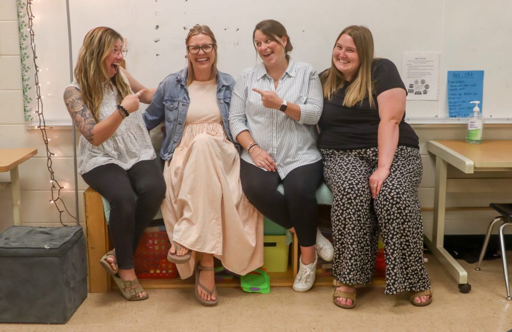 Teachers pose for a photo