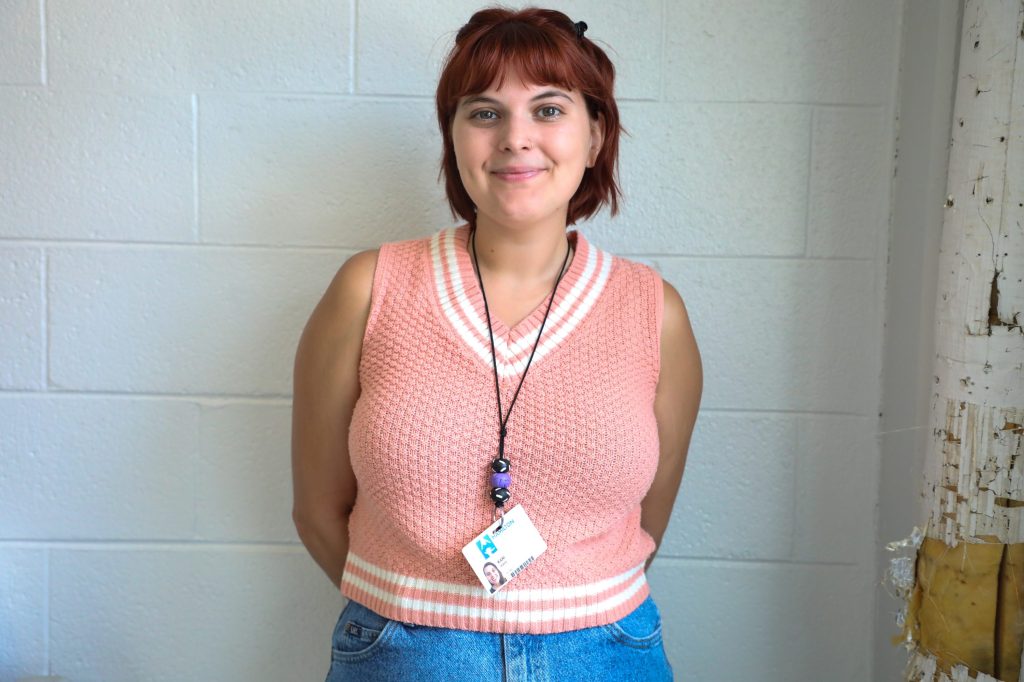 0D5A2038-2 teacher smiling in classroom