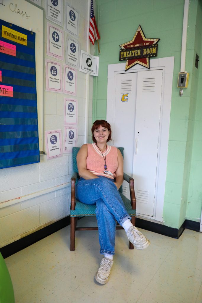 0D5A2056-3 teacher sitting in classroom