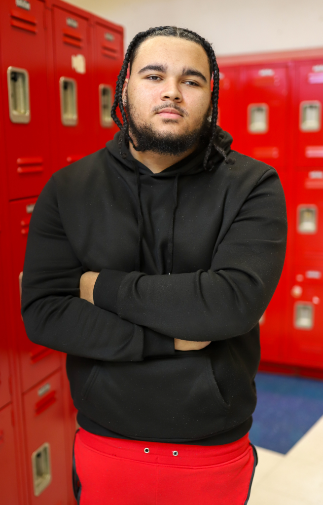 A student poses for a photo