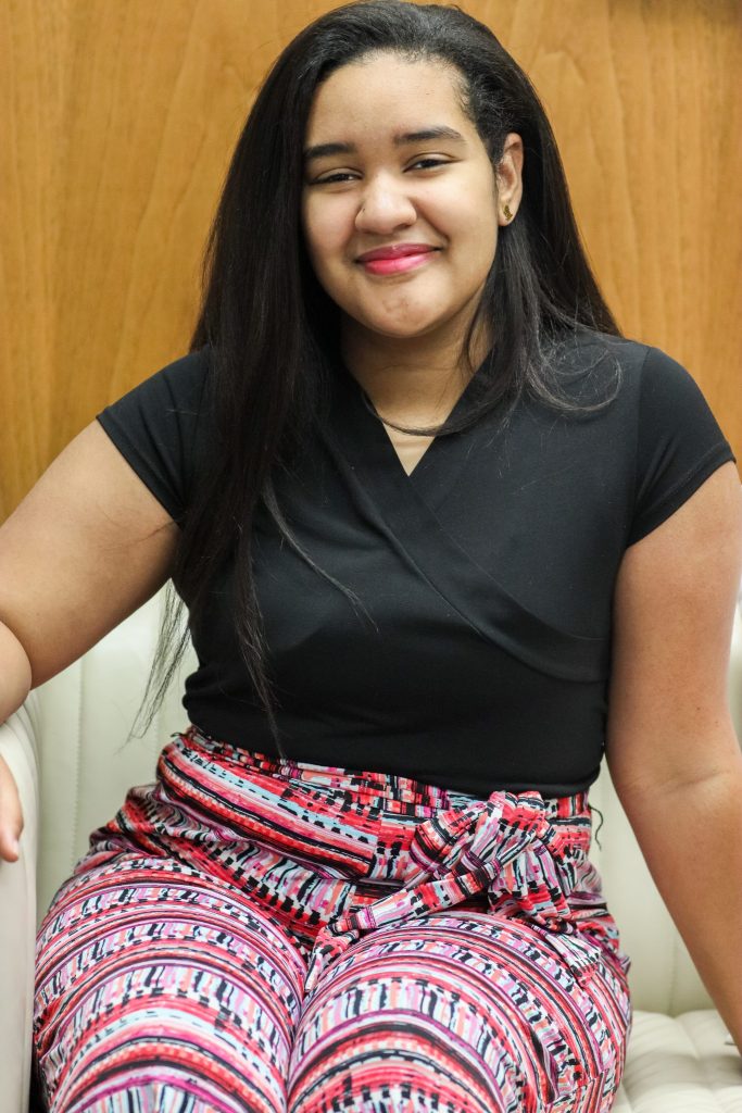 A student smiles for a photo