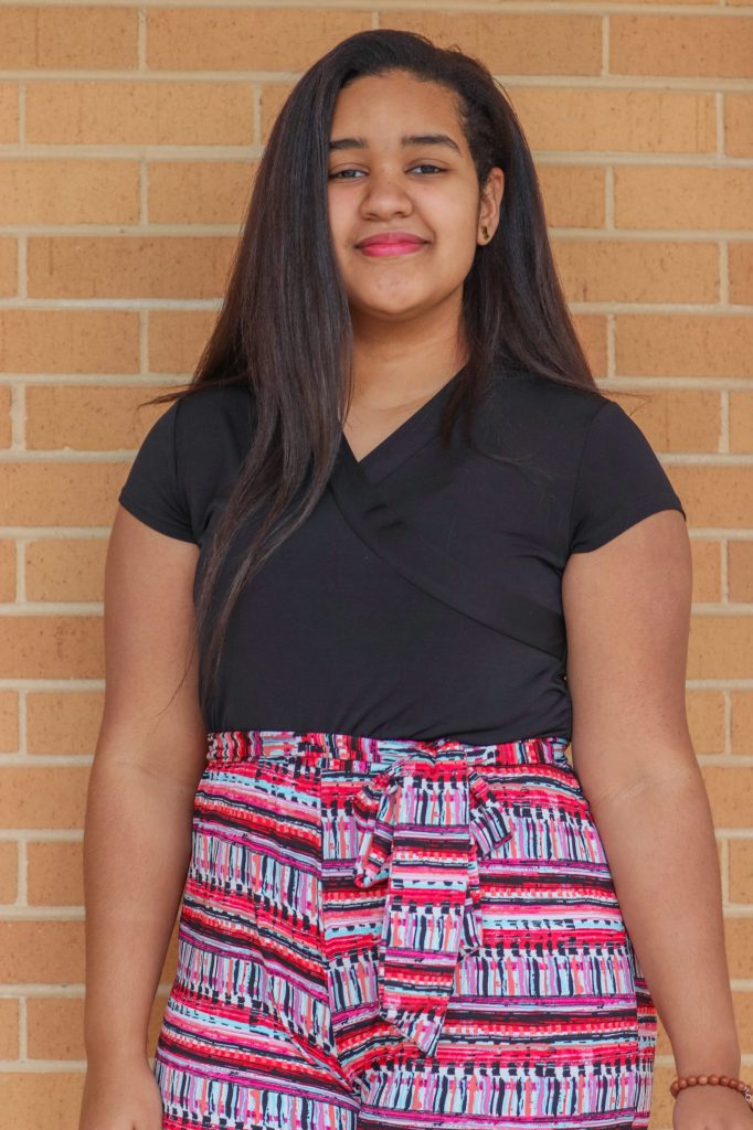 A student smiles for a photo