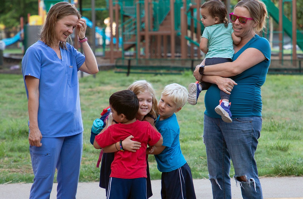 Students share a hug.