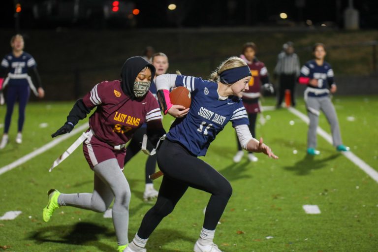 Girls play flag football