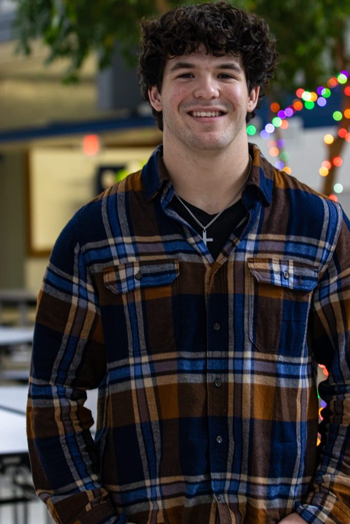 A student poses for a photo