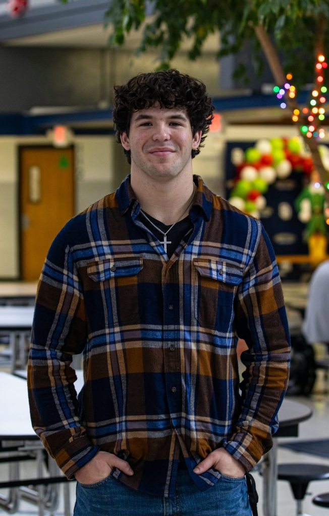 A student poses for a photo