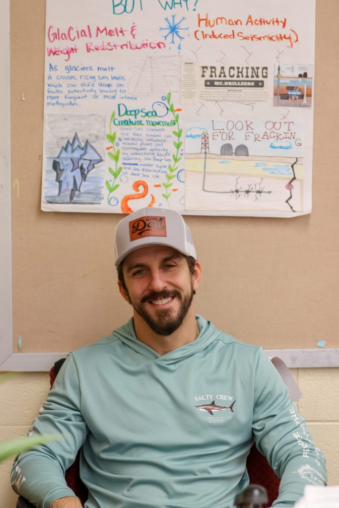 A teacher poses for a photo