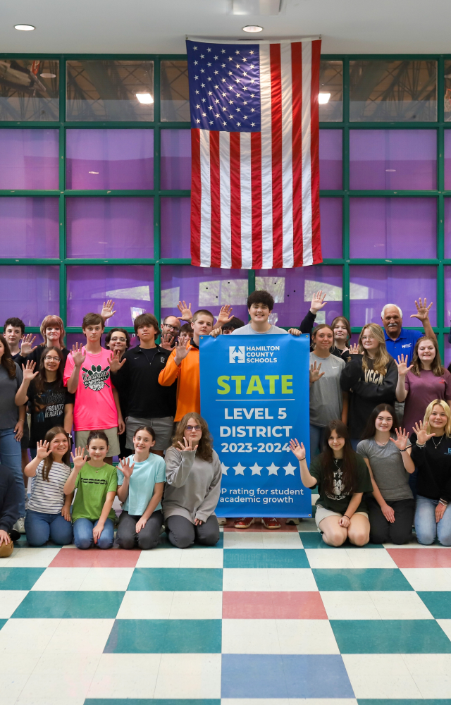 NEWSROOM COVER - Storybook Trail-12 Students pose for a banner presentation photo