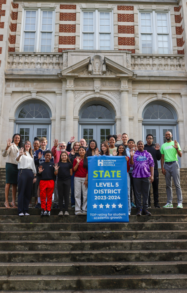 NEWSROOM COVER - Storybook Trail-15 Students pose for a banner presentation photo