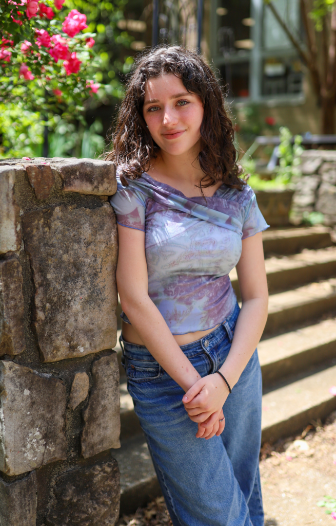 A student poses for a photo