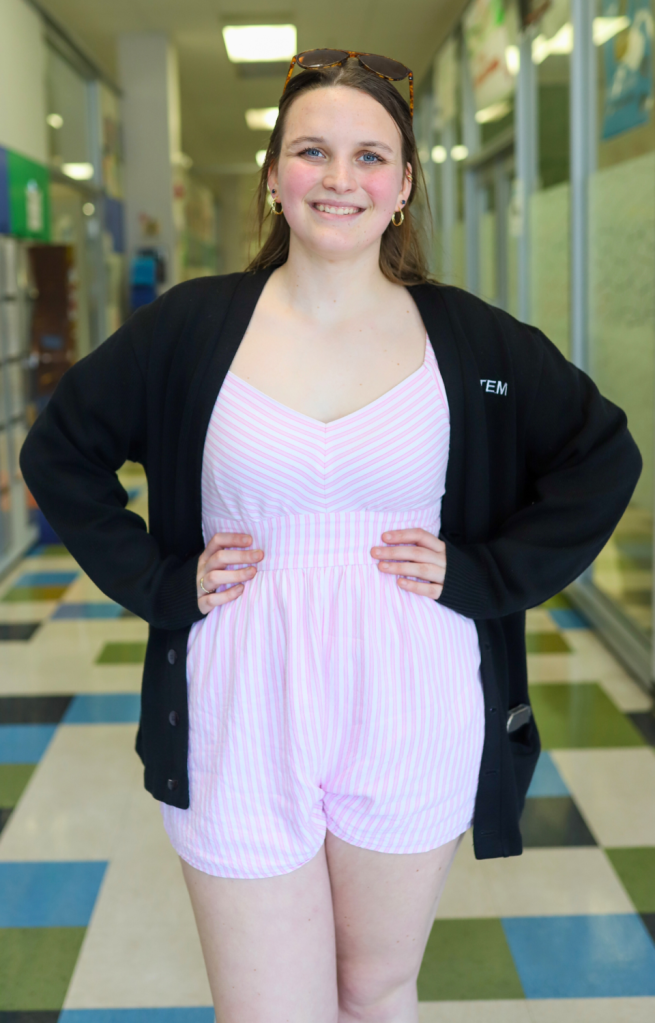 A student poses for a photo