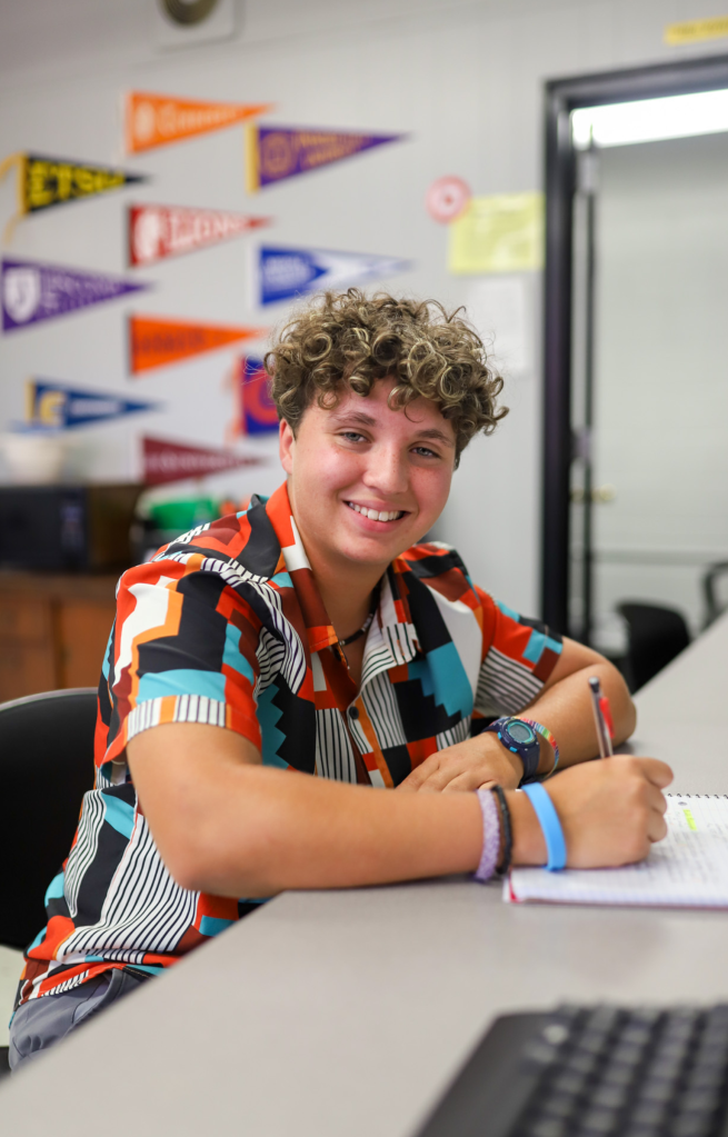 NEWSROOM COVER - Storybook Trail A student smiles for a photo