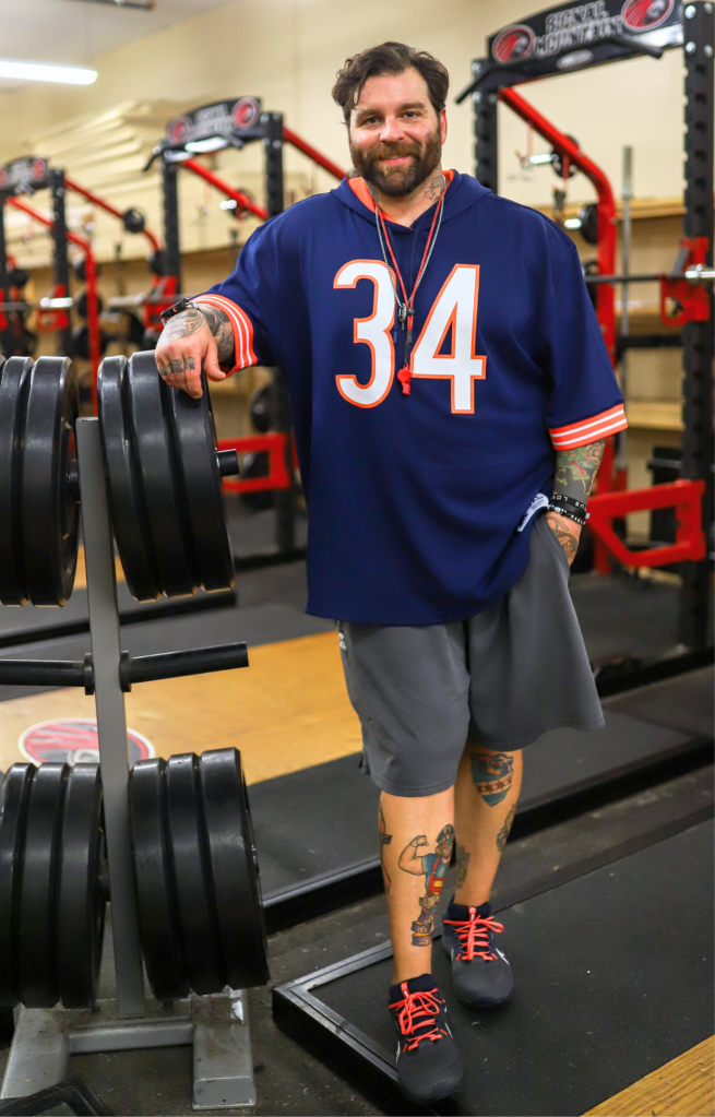 NewsroomMullins A teacher smiles for a photo