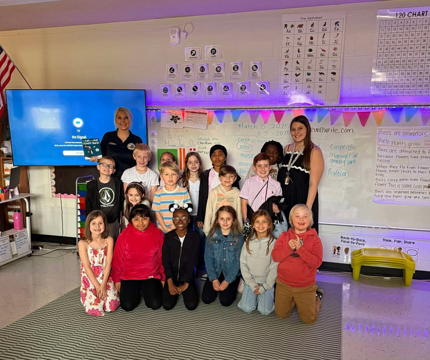 A class poses for a photo