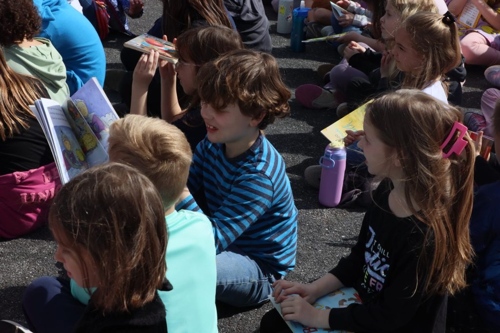 Children hold books