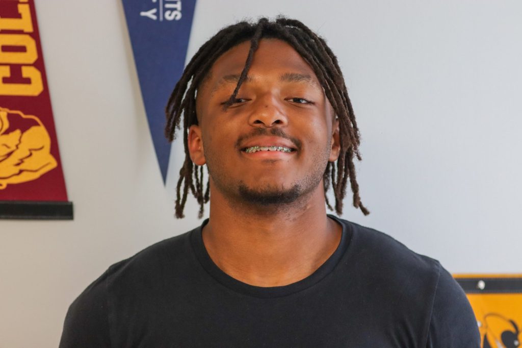 A student poses for a photo