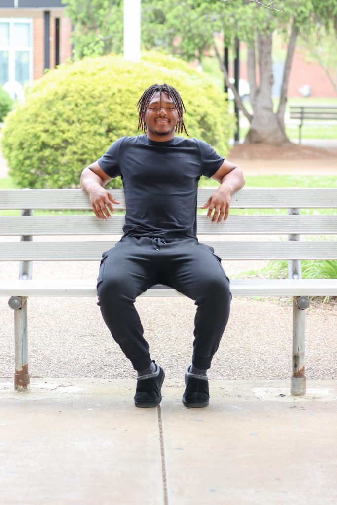 A student poses for a photo