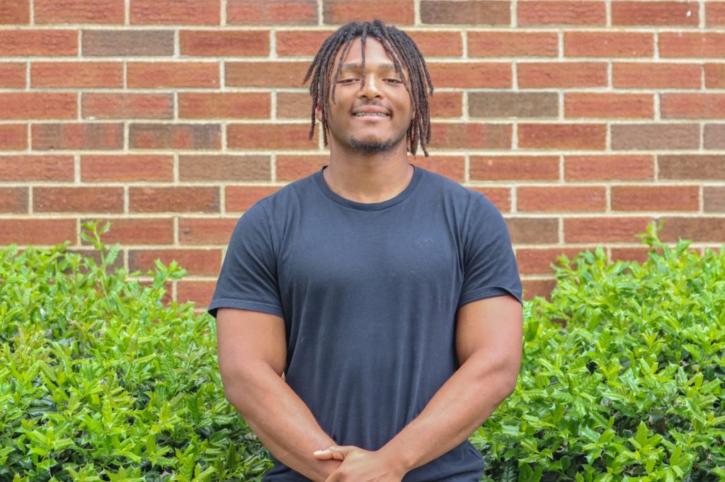A student poses for a photo