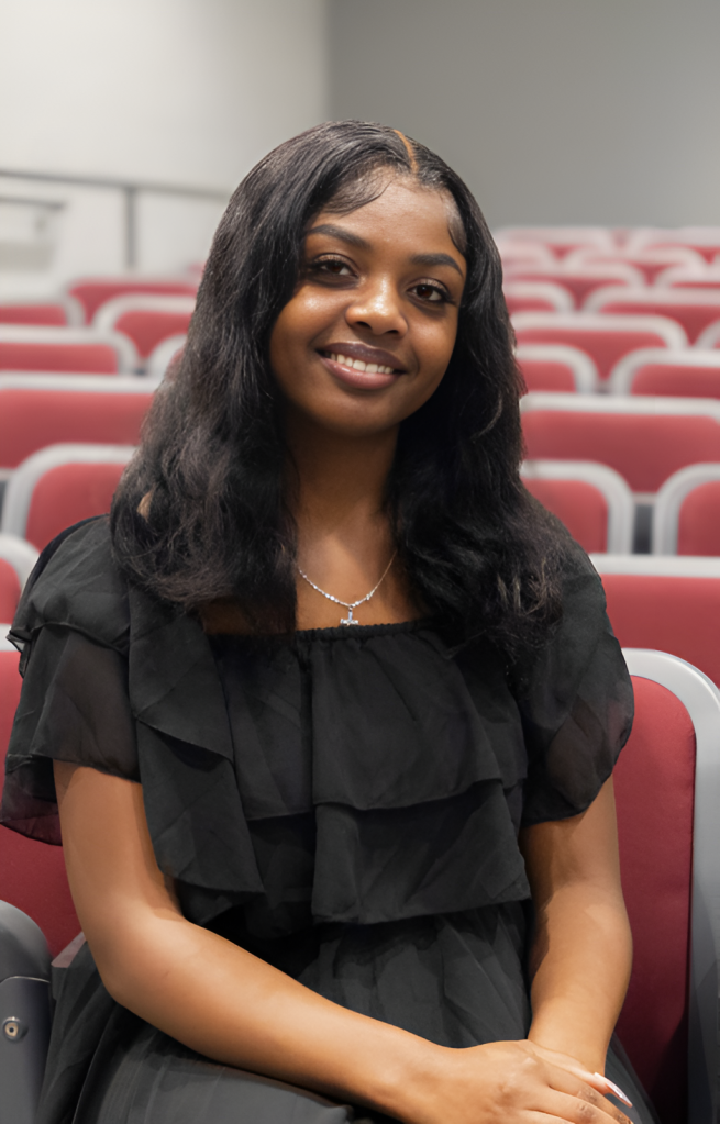 A student poses for a photo