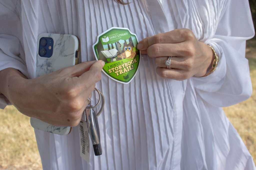A person holds a sticker