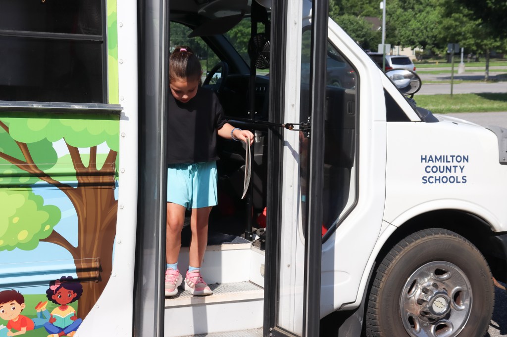 student on book bus