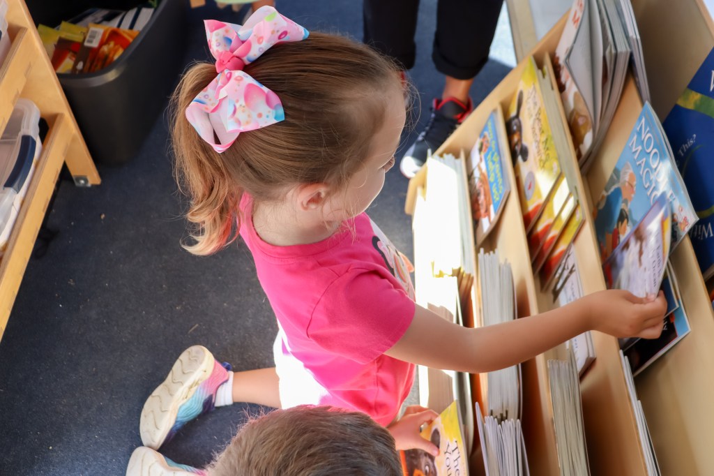 student looking at book