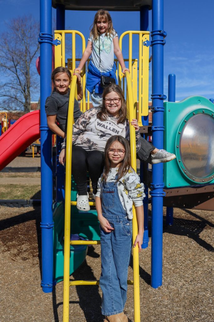 MccANDHixson-19 Students pose for a photo on a playground