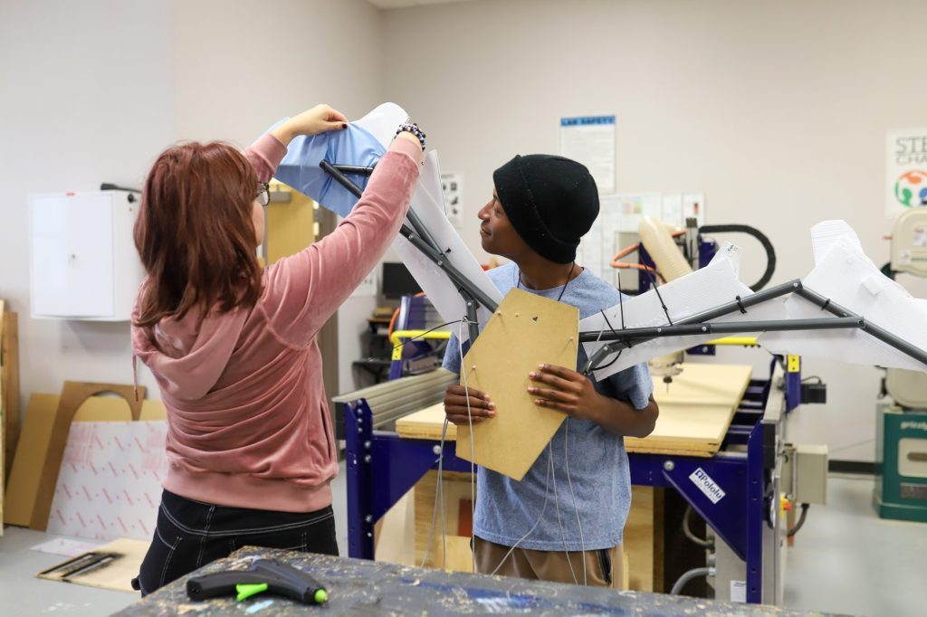 STEM-1 Two students work on a sculpture project
